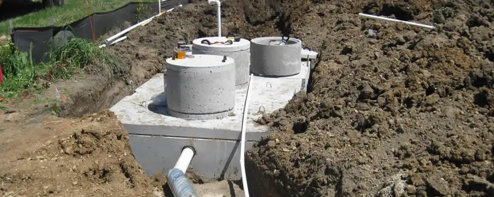 Septic system repair and installation site with tank access ports in Houston, TX