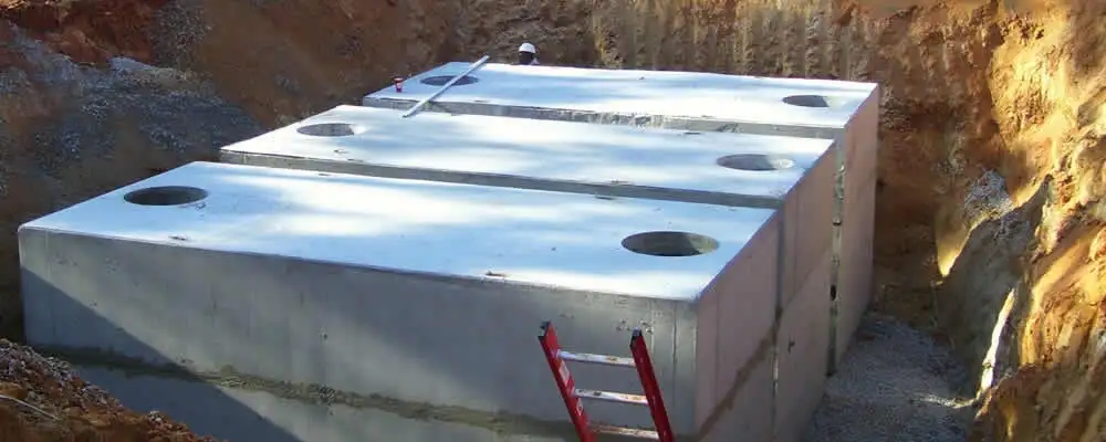 Septic tank installation site with a newly placed concrete tank in Houston, TX